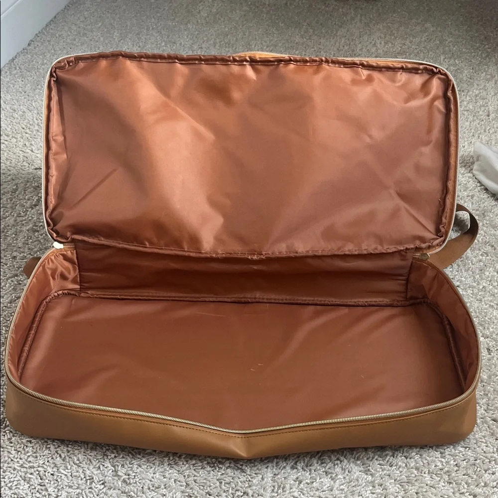 Stylish Navy and Tan carry on luggage with bottom storage